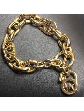 9044 Michael Kors Gold tone toggle MK Logo Lock chain Bracelet 8"